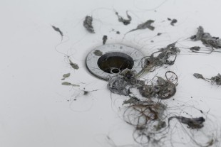 How Hair, Grease, and Debris Lead to Drain Blockages